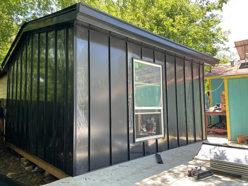 Black standing seam metal wall panels for Roof Inspection in Clewiston